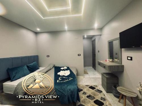 TV a/nebo společenská místnost v ubytování Pyramids View R Z Hotel