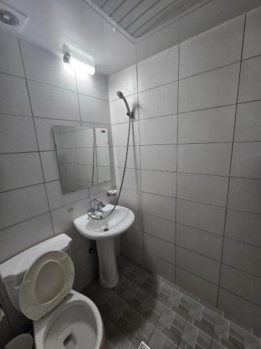 a bathroom with a toilet and a sink at Doggebi Stay in Gunsan
