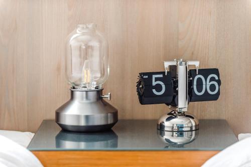 a table with a blender and a lantern on it at Penghu Sea Residences Hall in Magong