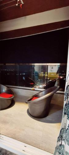 two metal bowls sitting on top of a counter at AeroNest - 3 BHK Apartment in Pune