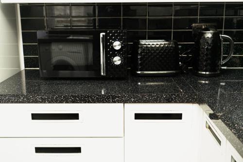 Dapur atau dapur kecil di Decosy Apartment