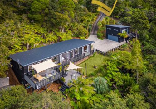 an aerial view of a house in the forest at Cosy Bush Apartment in Auckland