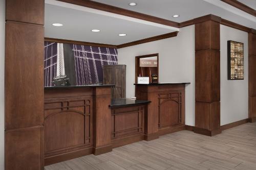a barber shop with wood paneling and a window at Staybridge Suites North Charleston by IHG in Charleston