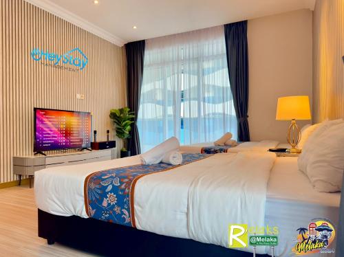 Postel nebo postele na pokoji v ubytování TheWave Residence By Heystay Management