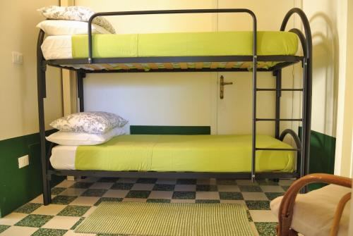 En eller flere senge i et værelse på Casa Canape