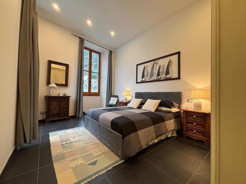 a bedroom with a large bed and a window at La Randa apartment in Vernazza