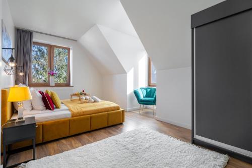 a bedroom with a bed and a large screen at WILLA JAROSTA & SPA, AC -free parking in Zakopane