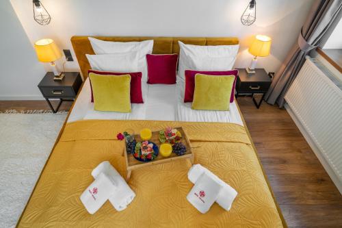 a large bed with a tray of food on it at WILLA JAROSTA & SPA, AC -free parking in Zakopane
