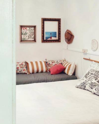 a bedroom with a bed and a mirror on the wall at Casalago in Domaso