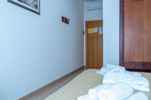 Postel nebo postele na pokoji v ubytování Hotel Rex