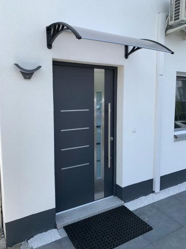 a black door on the side of a building at Luxus Appartement Motel Ambiente 2 in Bad Säckingen