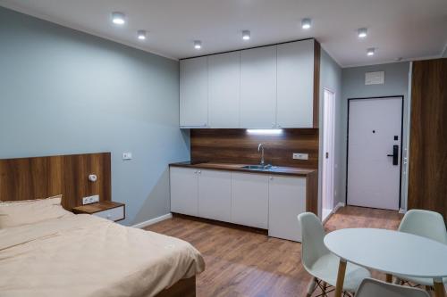 Postel nebo postele na pokoji v ubytování Paradise Apartments Solis Residence