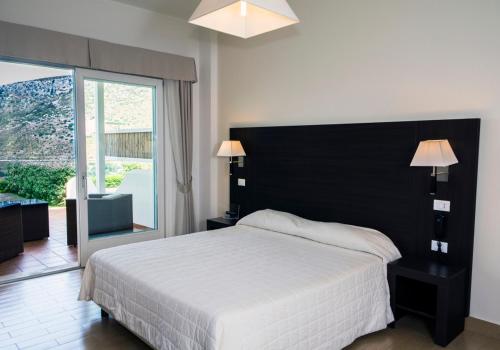 Ένα ή περισσότερα κρεβάτια σε δωμάτιο στο Moresco Park Hotel