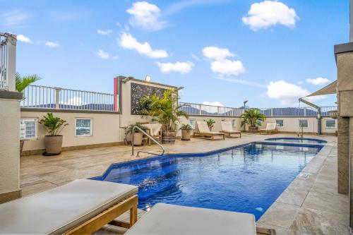 a swimming pool on the roof of a building at Inner City Gem - Stunning Views in Cairns