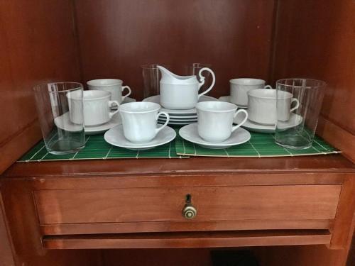 a group of cups and saucers on a dresser at La Almedina: Palacio de Foronda in Cazorla