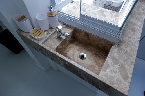 Et badeværelse på Kitnet Aconchego com sofisticação na Barra, Salvador, Bahia