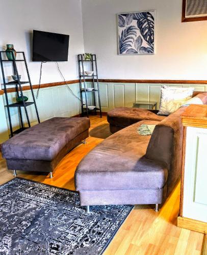 a living room with two ottomans and a couch at BayView in Port Elliot