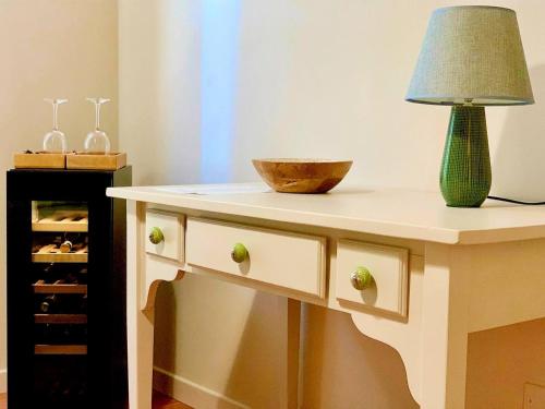 a table with a lamp and a bowl on it at Agriturismo Violati in San Gemini