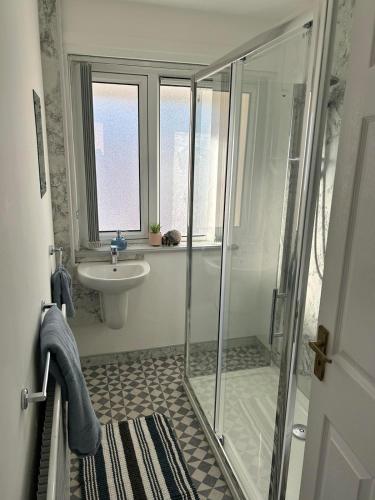 a bathroom with a shower and a sink at Central Apartment Newry City in Newry