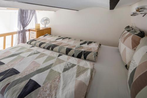 a small bedroom with a bed and a window at Casa Cavalli appartamento nuovo in Verscio