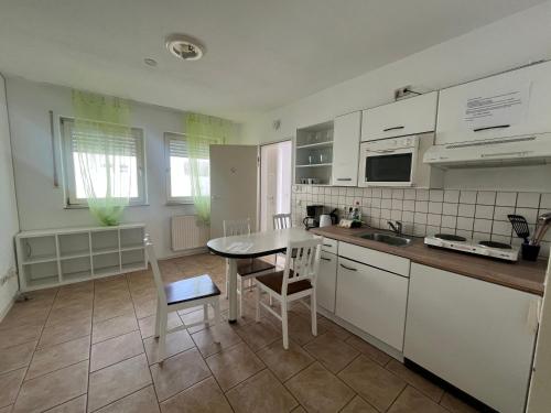 Kuchyň nebo kuchyňský kout v ubytování Apartmenthaus Home24