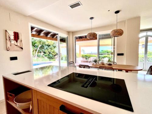 a kitchen with a large island with a sink at Exclusive house in Finestrat in Cala de Finestrat