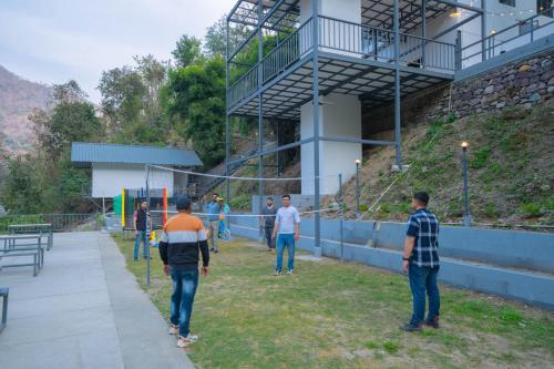 a group of people standing outside of a building at Perfectstayz The Jungle Resort, Shivpuri in Shivpuri