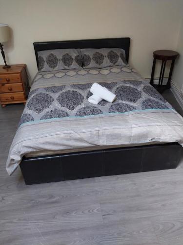a bed with two rolls of toilet paper on it at Queens Hotel in Blackburn