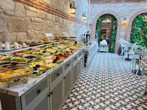 a buffet line with a lot of food on display at Saratoga Hotel Sultanahmet in Istanbul