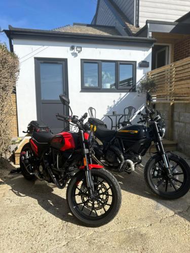 two motorcycles parked in front of a house at Highbanks in Newhaven