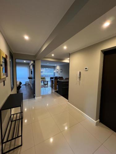 a view of a living room and kitchen in a house at Ballester's Dream in San Martín de los Andes