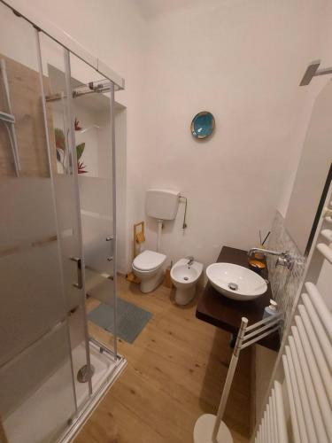 a bathroom with a toilet and a sink at BREZZA DEL CONERO in Ancona
