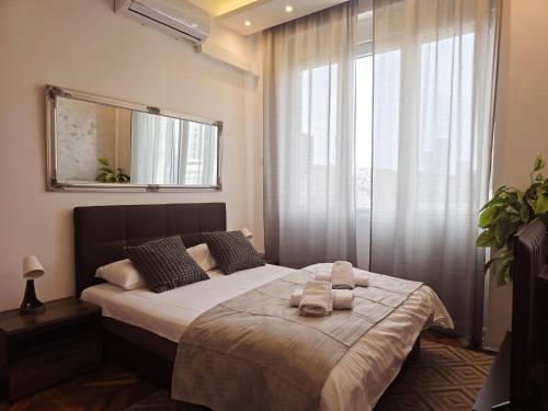 Ένα ή περισσότερα κρεβάτια σε δωμάτιο στο Marcel Apartments