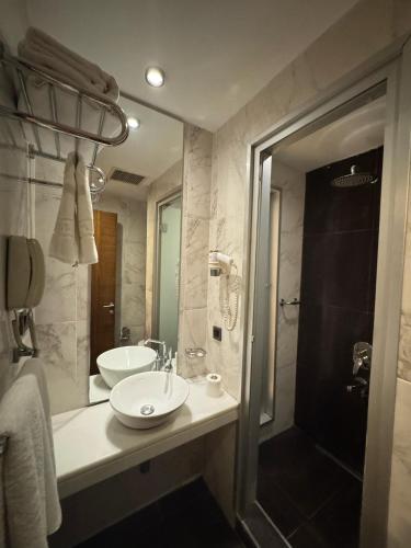 a bathroom with a sink and a shower at Style Star Hotel Cihangir in Istanbul