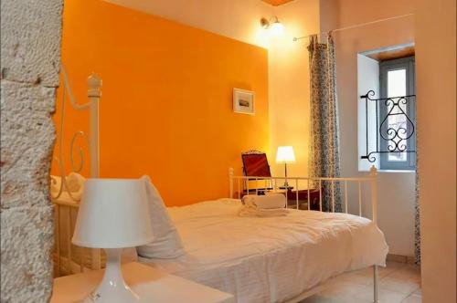 Ένα ή περισσότερα κρεβάτια σε δωμάτιο στο Casa Di Porto Vecchio