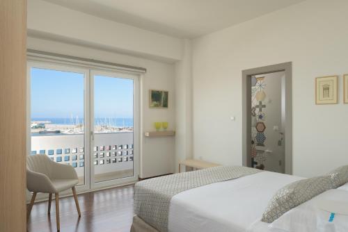 Tempat tidur dalam kamar di C'est La Vue