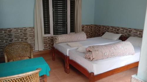 Llit o llits en una habitació de Hotel Unicorn
