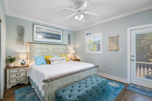 a bedroom with a bed and a ceiling fan at Blue Skies Cottage 29Cu By Pkrm in Pensacola