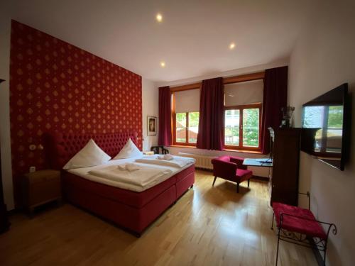 Una cama o camas en una habitación de Avalon Bed & Breakfast Themen/- Nichtraucherhotel
