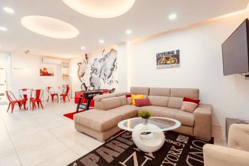 a living room with a couch and a table at LA 88 Boutique in St. Paul's Bay
