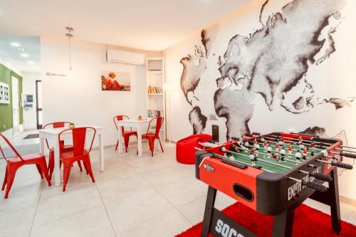 a room with a foosball table and a map on the wall at LA 88 Boutique in St. Paul's Bay