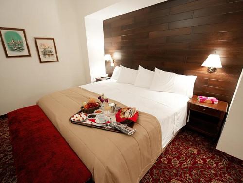 Postel nebo postele na pokoji v ubytování Printania Palace Hotel