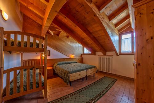 En eller flere senge i et værelse på Rifugio Predaia Ai Todes'ci
