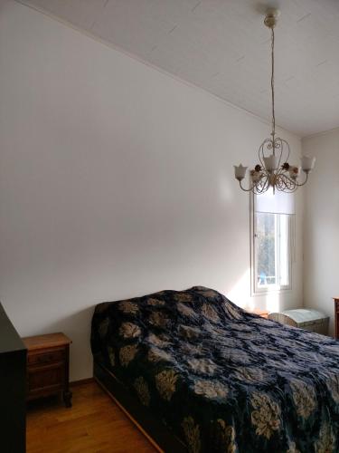 a bedroom with a bed and a window at 3 room apartment&terrace in Espoo