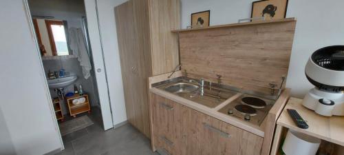 a small bathroom with a sink and a sink at CASA ALLE COSTE camere con vista in Massa Marittima
