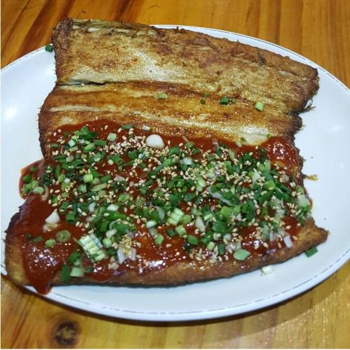 a white plate with two pieces of toast with sauce at Near Incheon airport, China town, Songdo, Inha Uni Hospital in Incheon