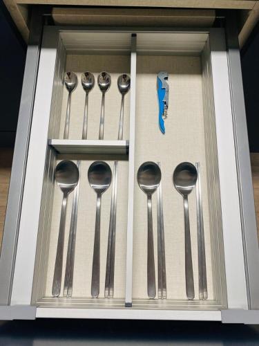 a group of measuring spoons in a drawer at Near Incheon airport, China town, Songdo, Inha Uni Hospital in Incheon