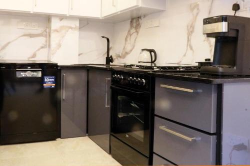 a kitchen with an oven and a stove top oven at Sunset Cove Ahangama in Ahangama