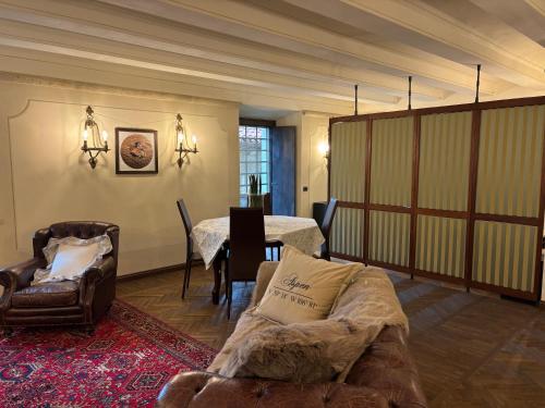 a living room with a couch and a table at Borgoloto Suite 17 in San Marino