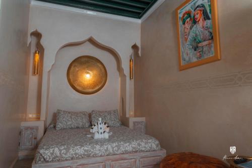 a bedroom with a bed with a large orb on the wall at PALACIO AL ANDALUS in Chefchaouene